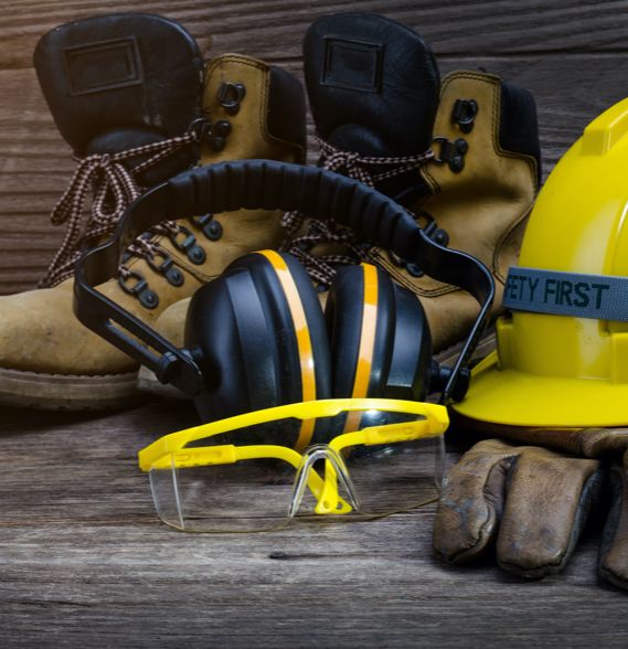 Safety boots, hearing protection, goggles, gloves, and a safety helmet