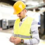 distracted factory worker on phone unsafe