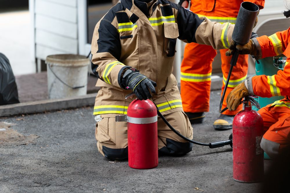 workers test fire extinguisher