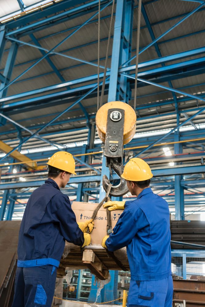 workers doing material handling at job site