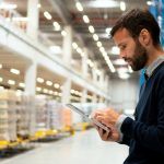 manager uses checklist in workplace