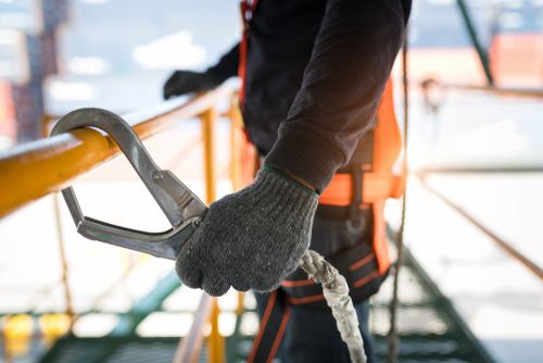 Construction Worker Wearing Safety Harness - Construction Site Safety