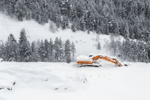 Excavator Covered With Snow - Winter Equipment Inspections