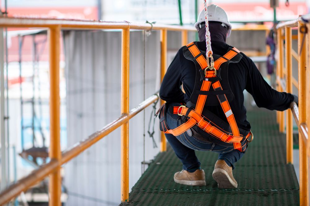 workers in safety gear performing due diligence