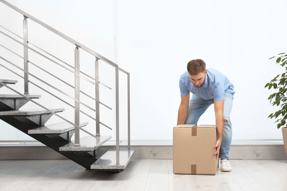 employee carrying a box