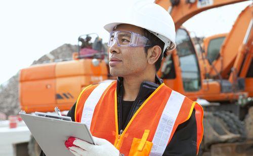 safety instructor wearing orange vest