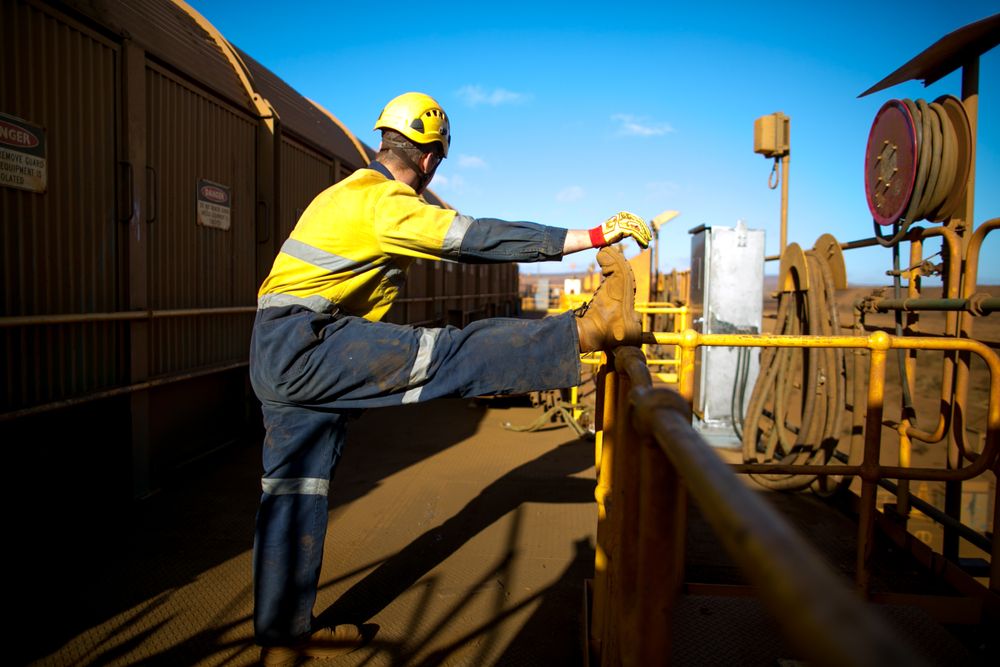 worker stretching before lifting