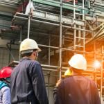 workers in hard hats at construction site