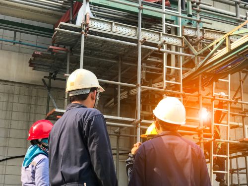 workers in hard hats at construction site