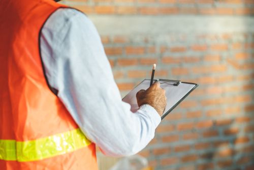 safety consultant writing on board