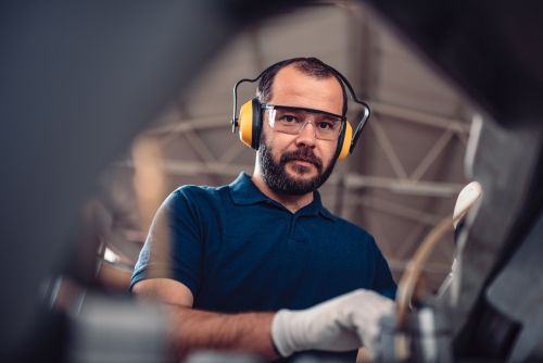 man using headphones at the workplace