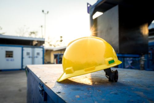 hardhat laying on table in workplace