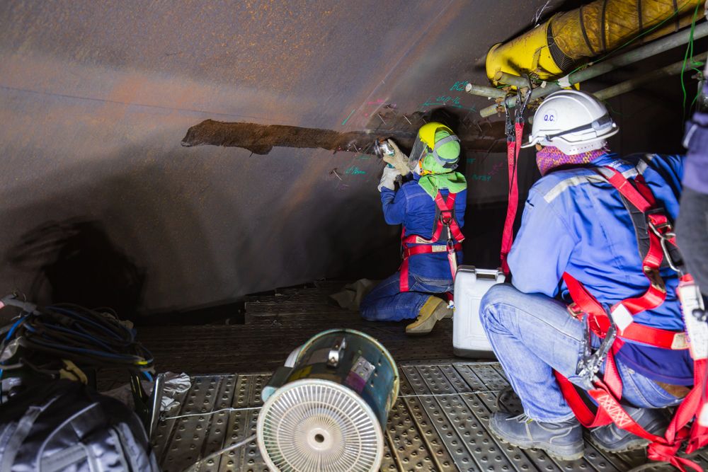 team performing confined space entry