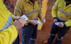 workers taking notes about workplace safety