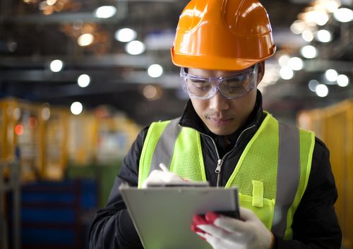 man in hard hat & vest checklist