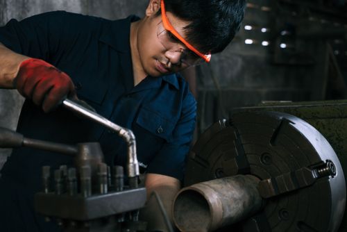 man working safely with machine tools