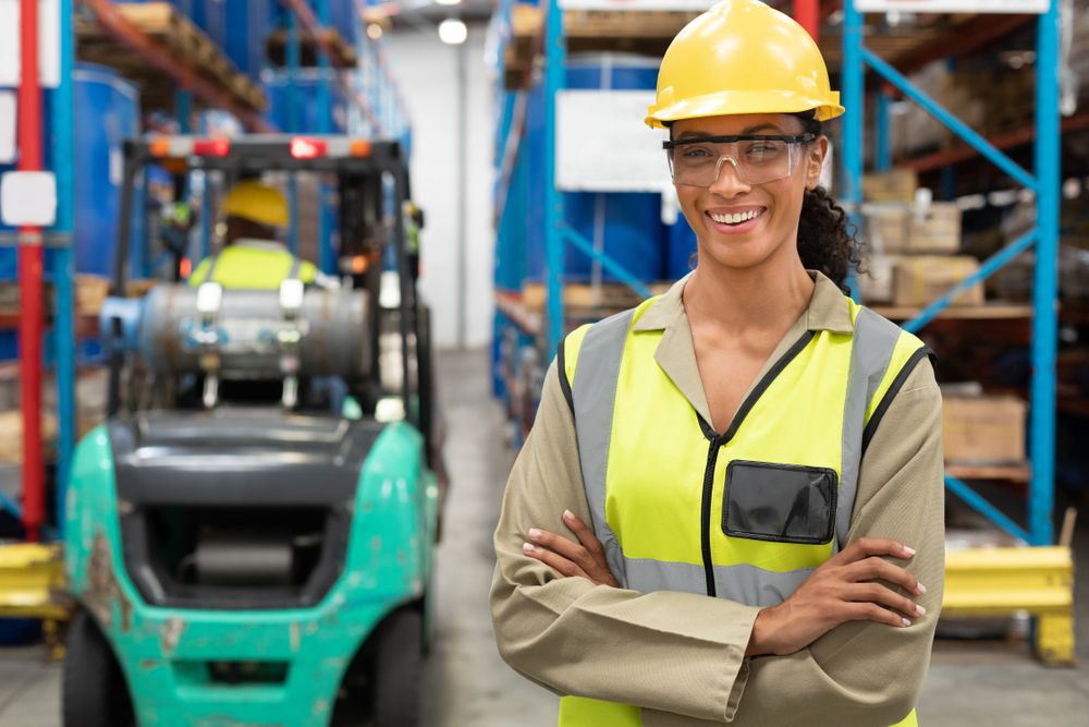 worker that is happy in their safe working environment