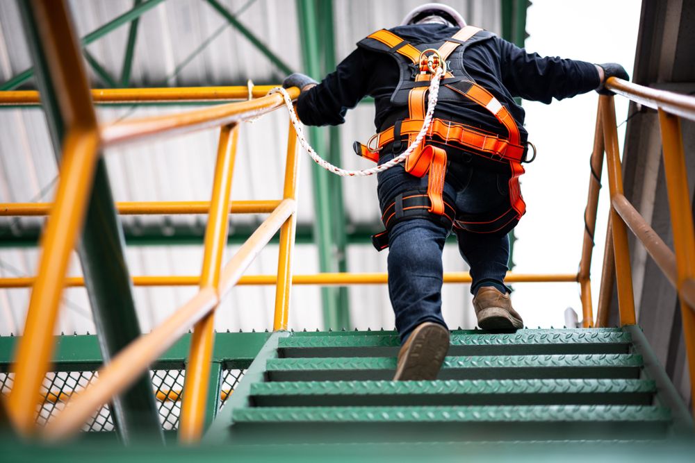 man working at heights with restraints
