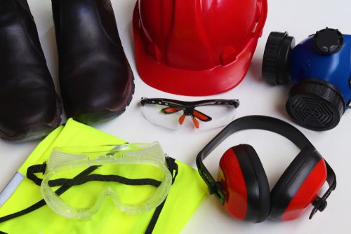 collection of PPE including hard hat, goggles, ear muffs, etc