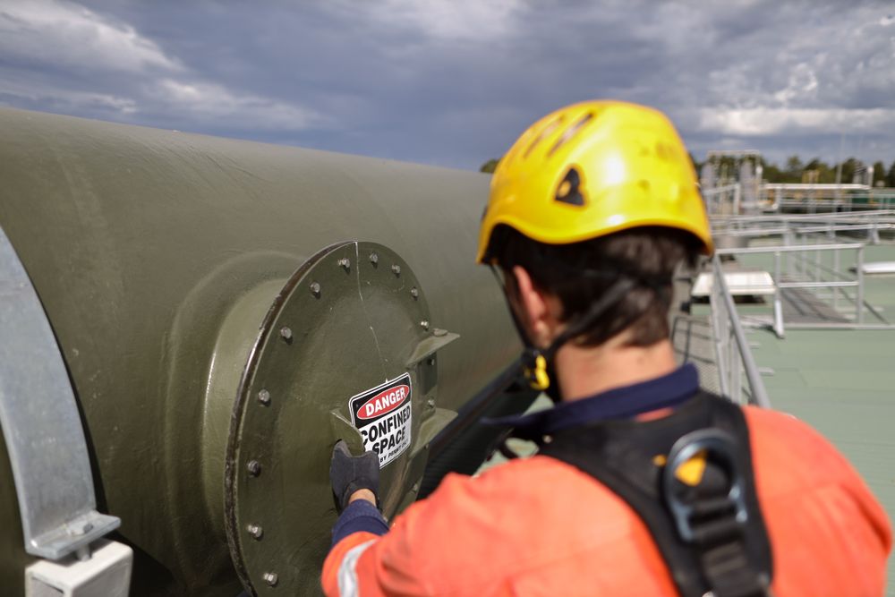 man checking confined space entry