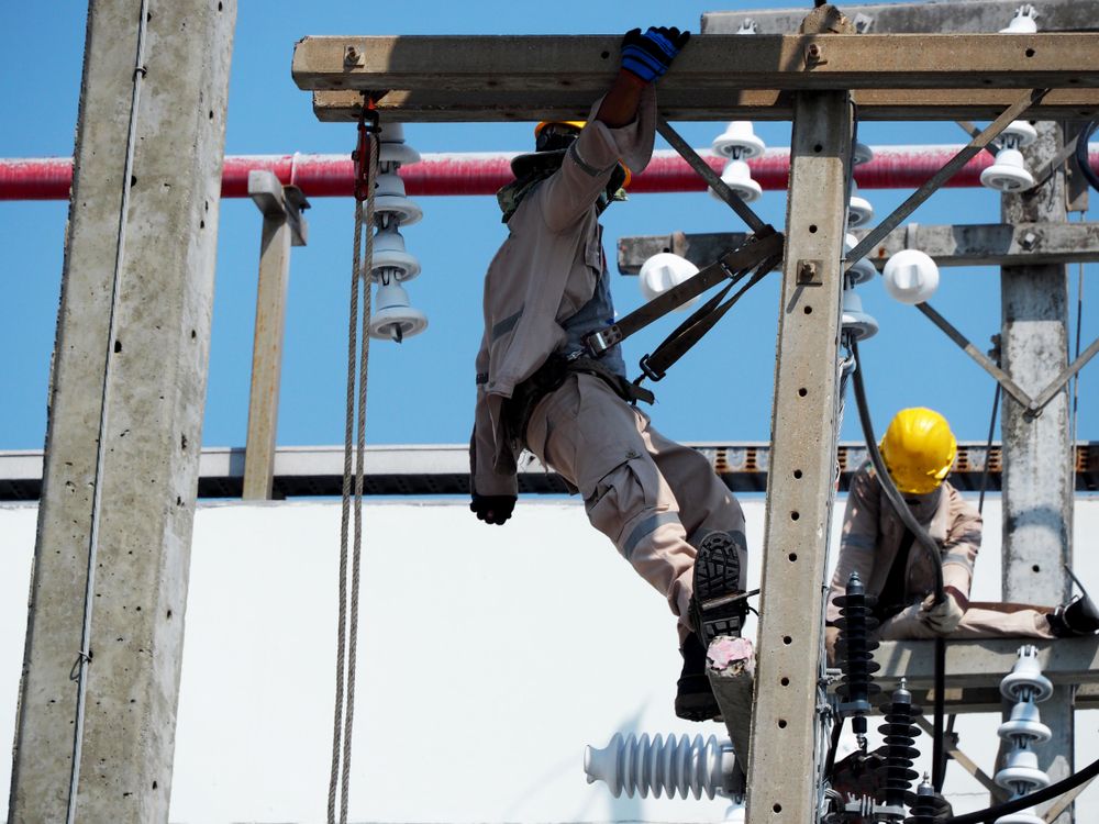 electrical workers working at heights
