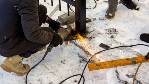 Worker Make Metal Fence At Winter Time - Winter Safety