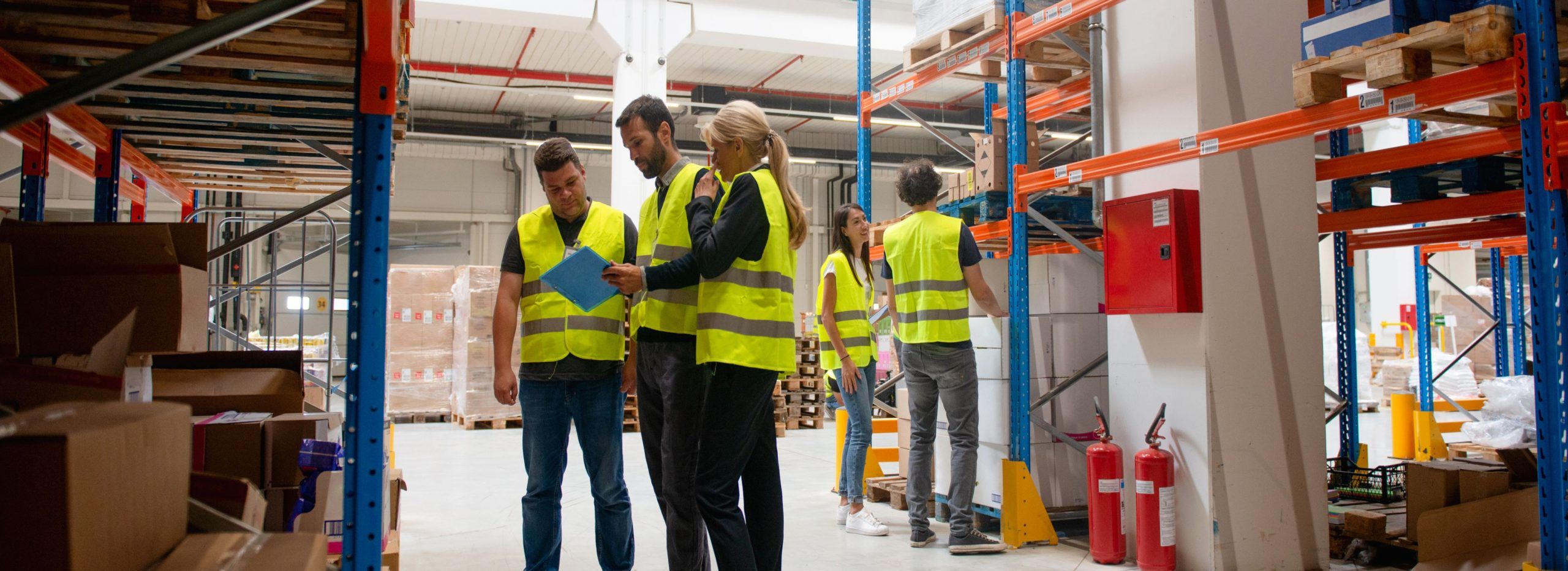 a warehouse supervisor conducting safety awareness training at work
