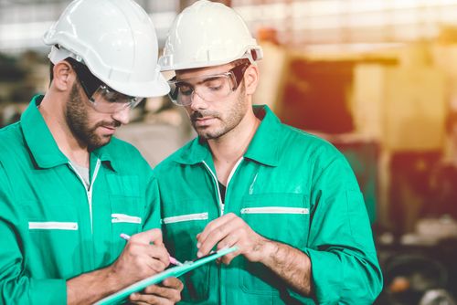 Engineers Checking Factory for Workplace Safety Issues