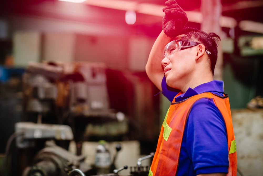 worker suffers from heat exhaustion