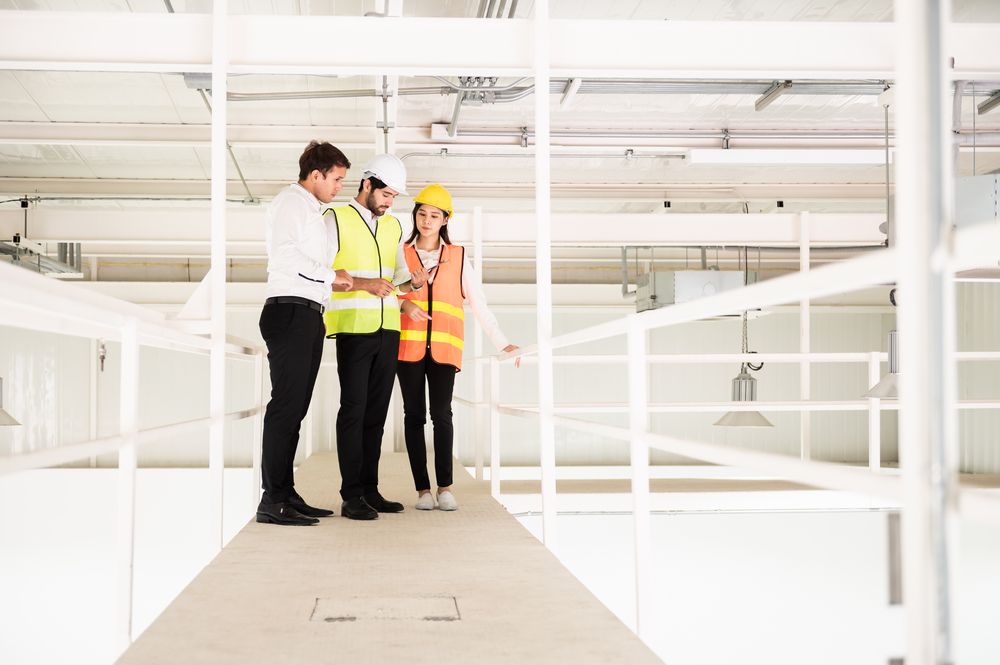 workplace safety inspector meets with supervisors