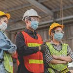 worker wears covid mask on the job