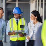 manager instructs workers on fire safety