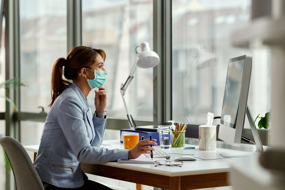 woman in office thinks about workplace safety