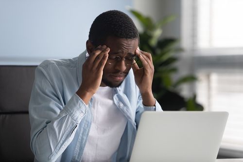 man working from home is stressed out