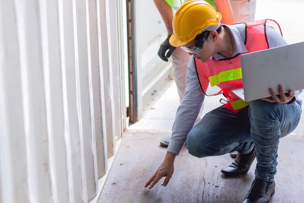 a safety inspector reviewing the workplace to spot any gaps in their program