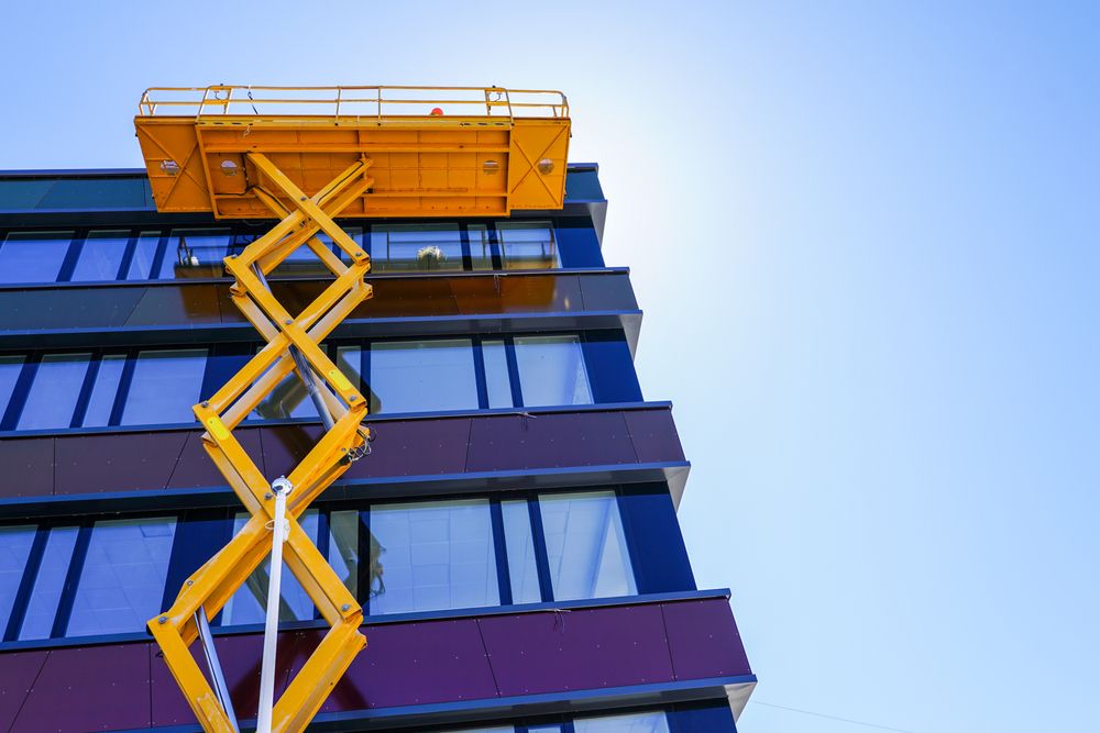 scissor lift platform cleaning windows