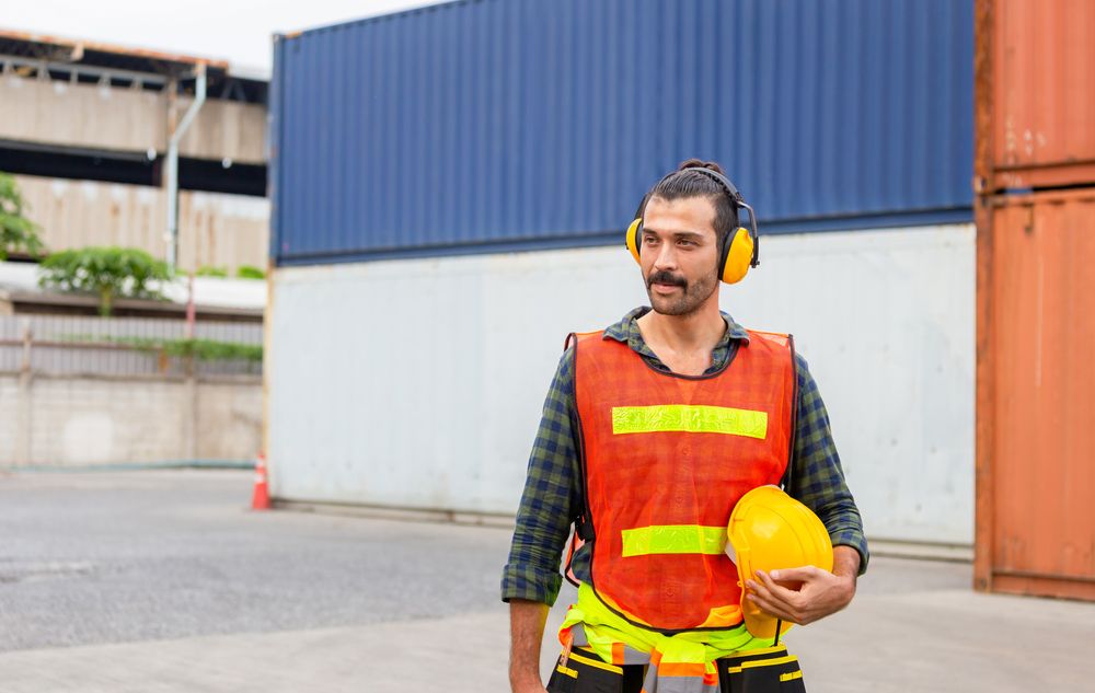 worker wears safety gear at workplace