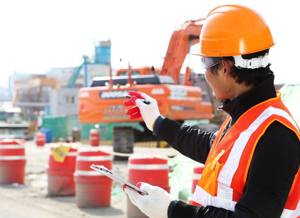 a construction site manager doing a workplace inspection