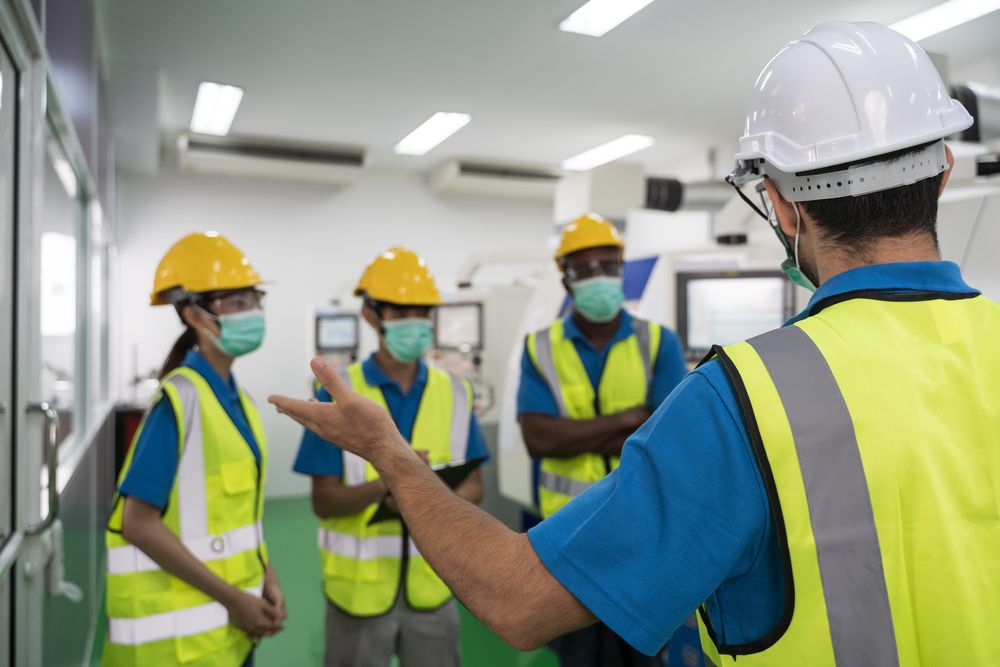 safety professional conducting training for current employees in at a workplace