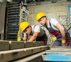 men in hard hats working with wood