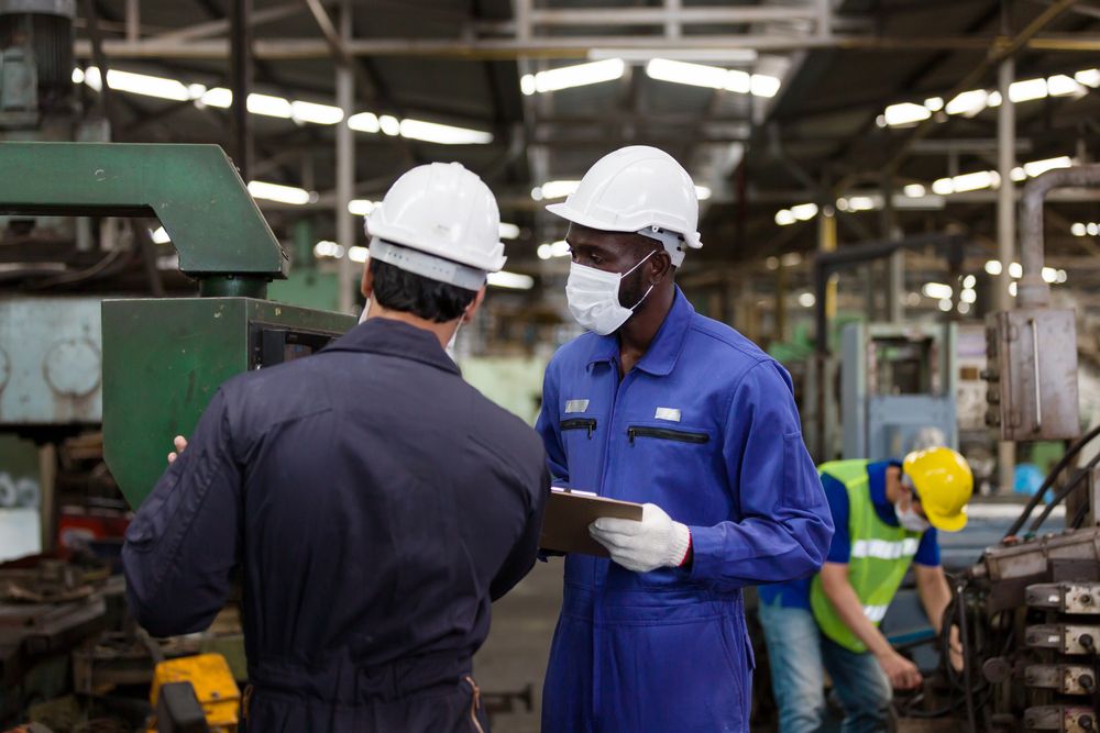 supervisor and safety auditor assessing workplace gap analysis