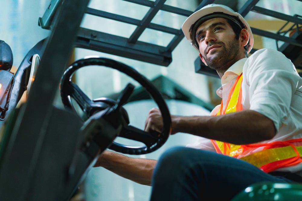 warehouse worker operating machinery