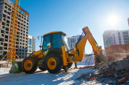 Excavator Digs The Ground In Winter - Winter Equipment Inspections