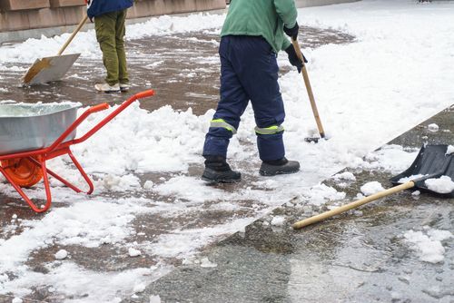 man removes snow