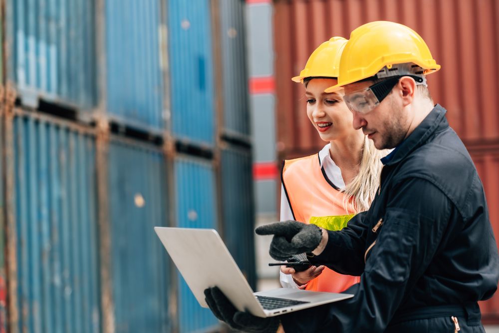safety consultant working with a warehouse employer on their safety policy for natural disasters