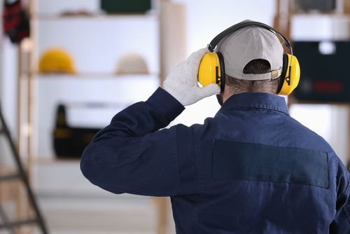 Worker Wearing Safety Headphones - Health and Safety Consulting