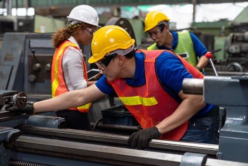 construction worker uses heavy machinery