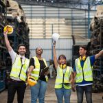 Four workers celebrating a safe day