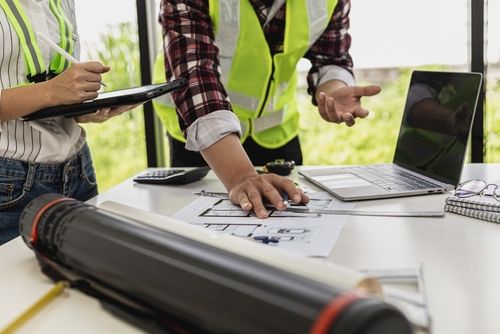 Engineers Looking At Blueprints - Safety Software Benefits