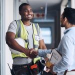 Two workers shaking hands